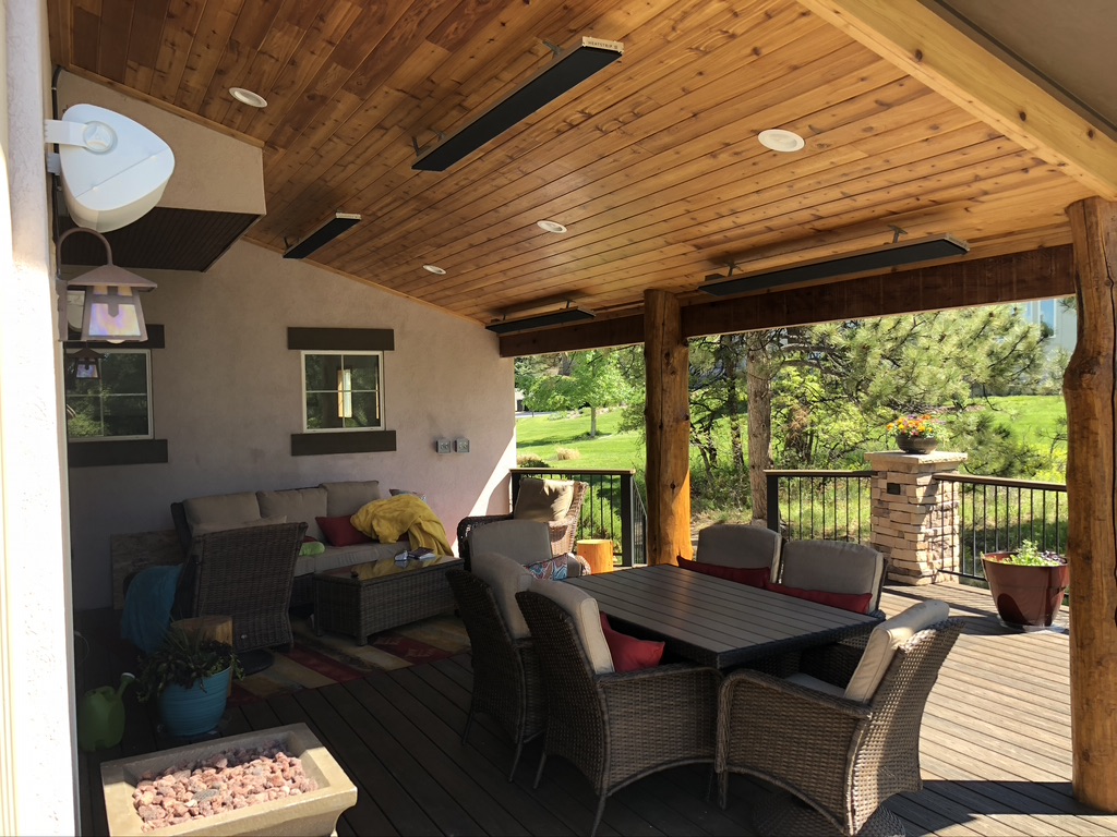 An outdoor covered deck offering shade and weather protection with heaters in Denver, Colorado.
