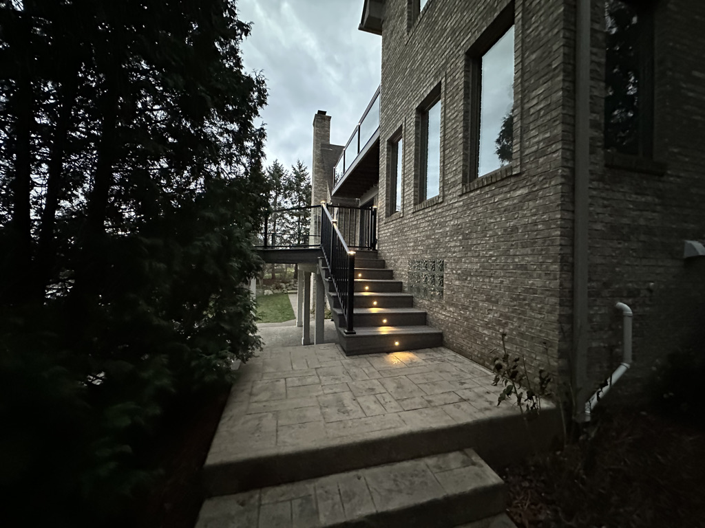 Outdoor Deck Staircase with lighting custom built by Elevated Outdoor Living Co in Commerce Michigan
